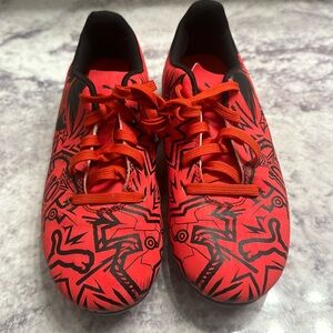 Youth red and black Puma soccer cleats. Size 1